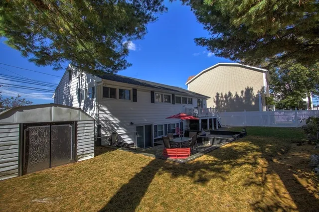 a view of a house with a chairs in a patio