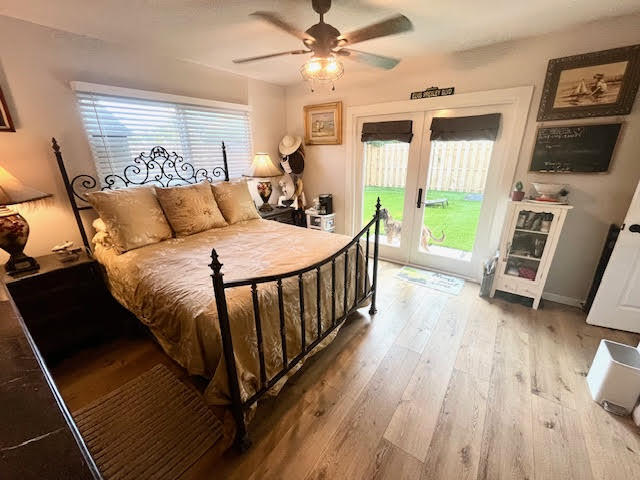 200 Lancaster Street Boca Raton, FL 33487 - Photo 21 of 43 a bedroom with a bed and a flat tv screen