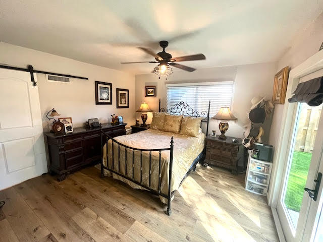200 Lancaster Street Boca Raton, FL 33487 - Photo 22 of 43 a spacious bedroom with a bed and a flat screen tv