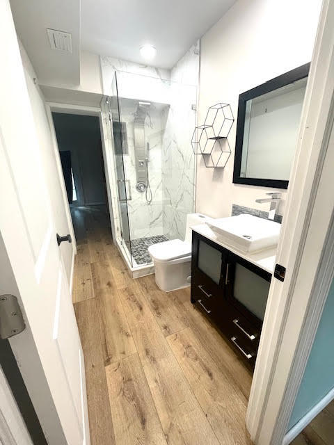 200 Lancaster Street Boca Raton, FL 33487 - Photo 25 of 43 a bathroom with a sink a toilet a mirror and shower