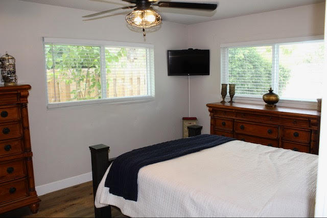 200 Lancaster Street Boca Raton, FL 33487 - Photo 26 of 43 a bedroom with a bed and a flat screen tv