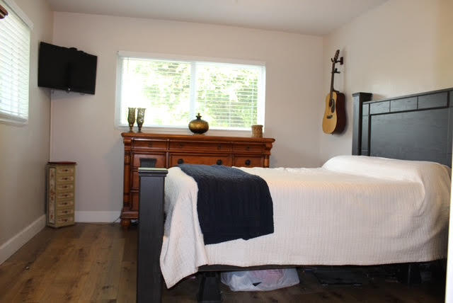 200 Lancaster Street Boca Raton, FL 33487 - Photo 27 of 43 a bedroom with a bed and flat screen tv