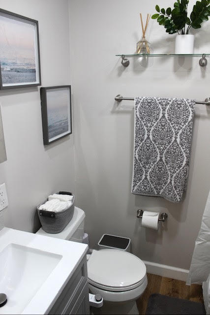 200 Lancaster Street Boca Raton, FL 33487 - Photo 29 of 43 a white toilet sitting next to a bathroom sink