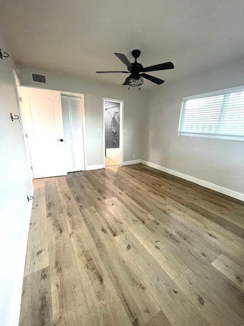 200 Lancaster Street Boca Raton, FL 33487 - Photo 31 of 43 a view of a big room with wooden floor closet and windows
