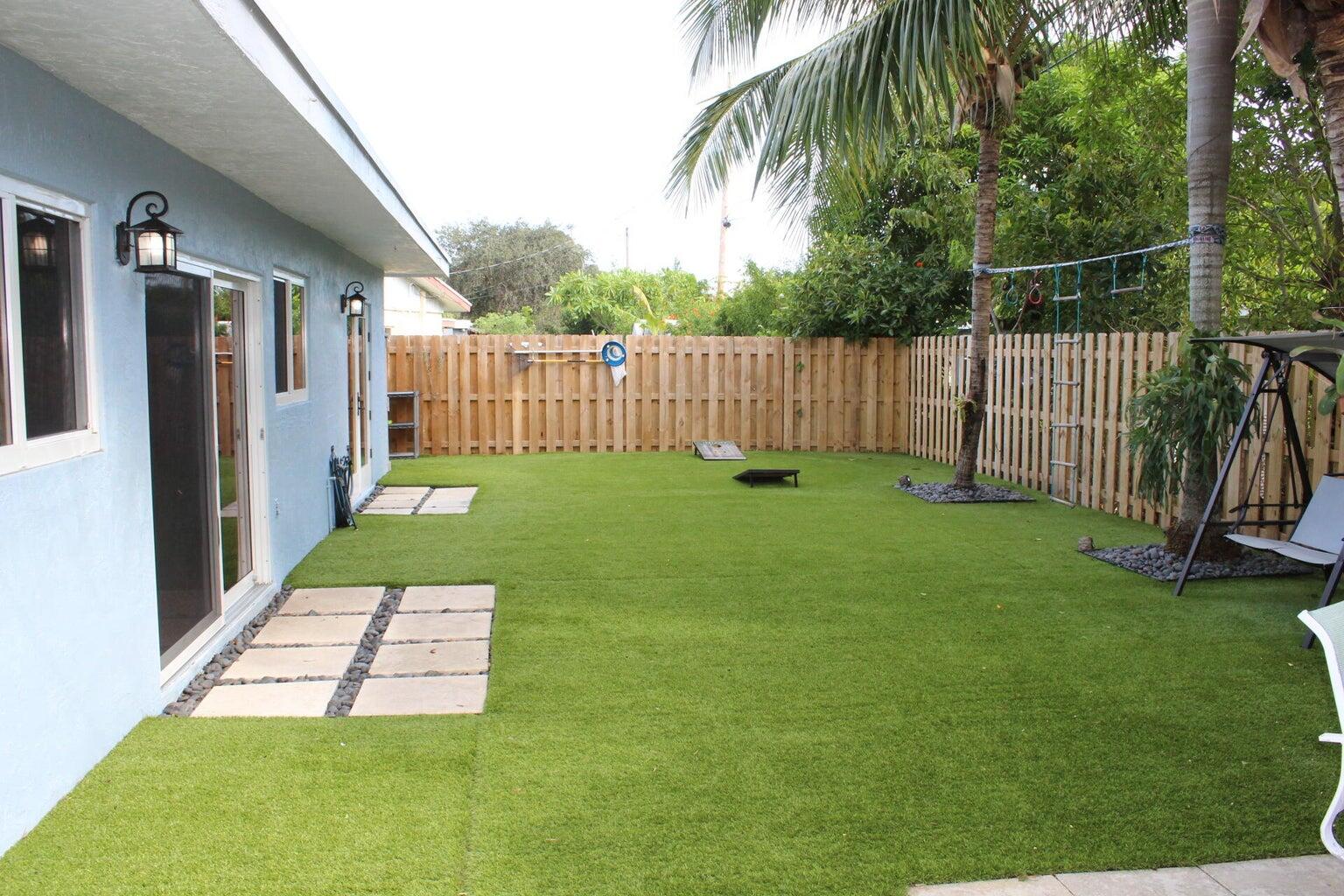 200 Lancaster Street Boca Raton, FL 33487 - Photo 42 of 43 a view of a backyard with a garden