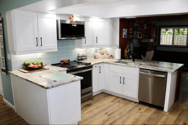 200 Lancaster Street Boca Raton, FL 33487 - Photo 6 of 43 a kitchen with a sink stove and cabinets