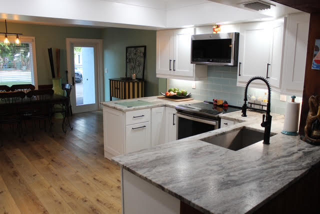 200 Lancaster Street Boca Raton, FL 33487 - Photo 7 of 43 a kitchen with granite countertop a sink a stove and cabinets