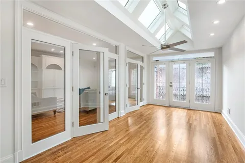 a view of an empty room and glass door