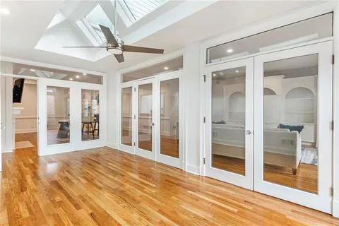 a view of an entryway with wooden floor