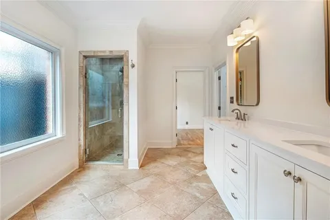 a spacious bathroom with a double vanity sink mirror and