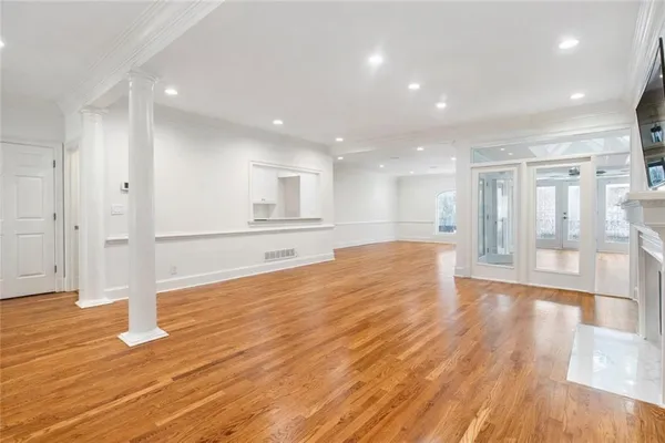 a view of a kitchen with wooden floor and a kitchen