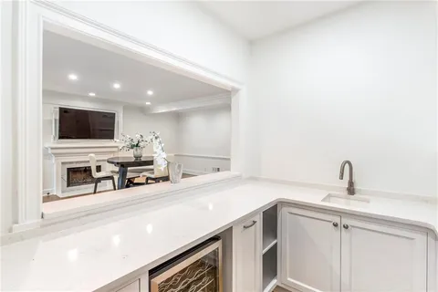 a kitchen with stainless steel appliances a sink and a microwave