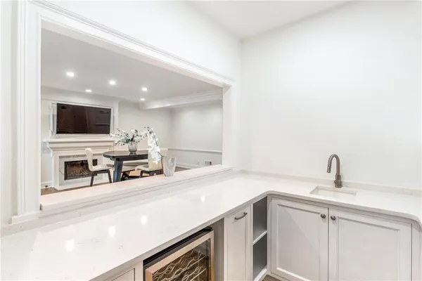 a kitchen with stainless steel appliances a sink and a microwave