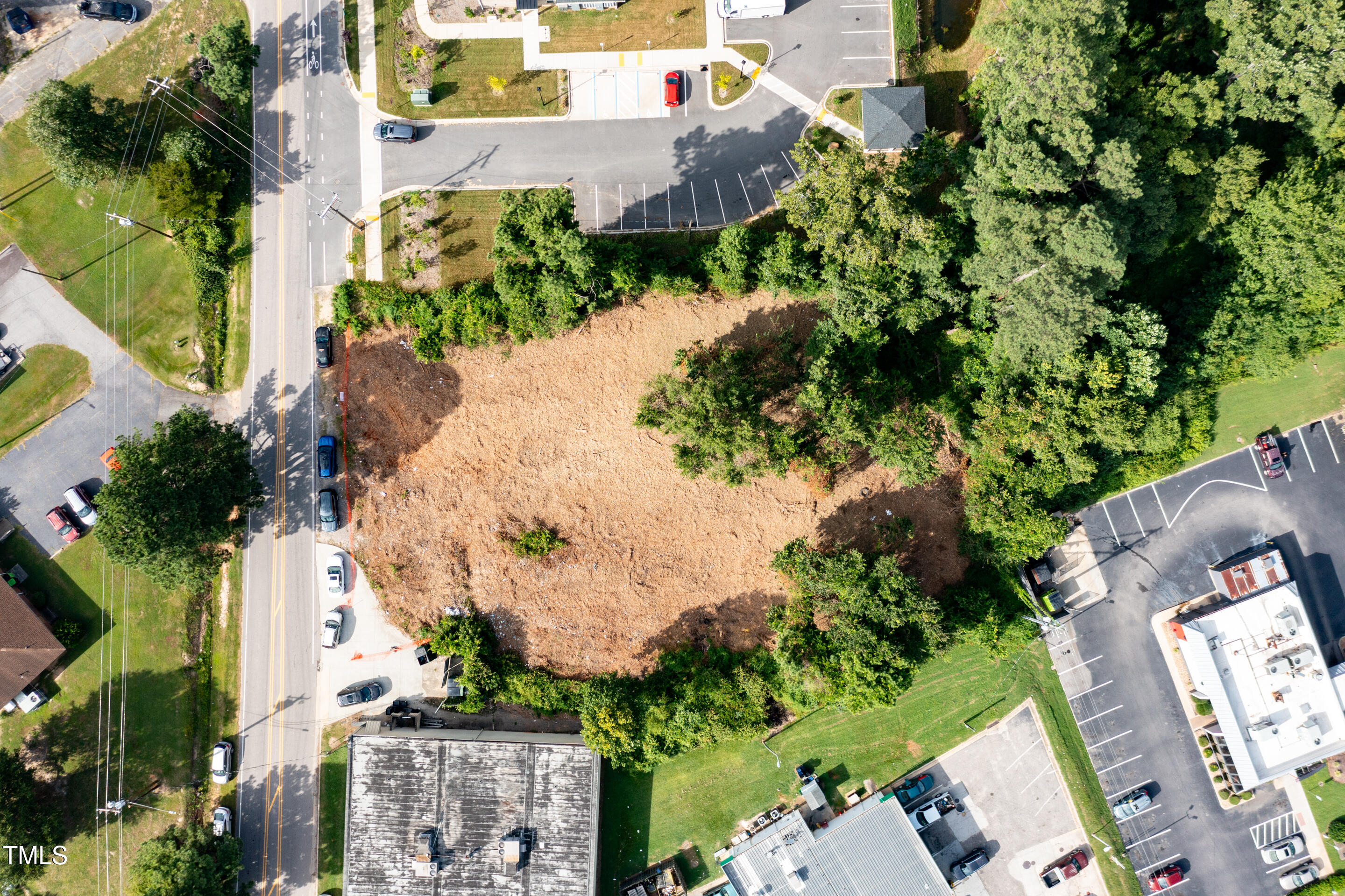 301 Pony Road Zebulon, NC 27597 - Photo 10 of 10 an aerial view of a house with a yard and a wooden fence