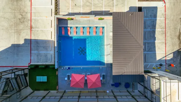 an outdoor space with pool and furniture