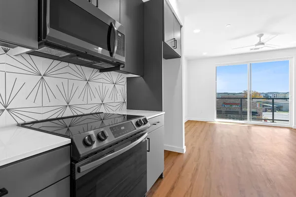 a kitchen with a stove and a microwave