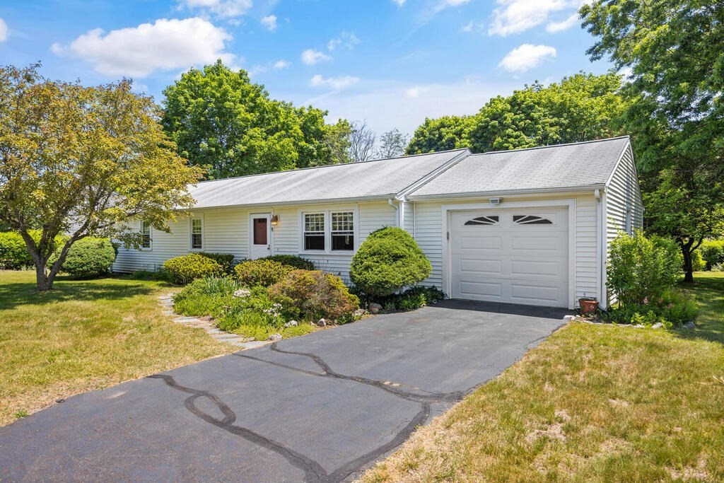 11 Rickey Drive Maynard, MA 01754 - Photo 1 of 29 a view of a house with a yard and potted plants