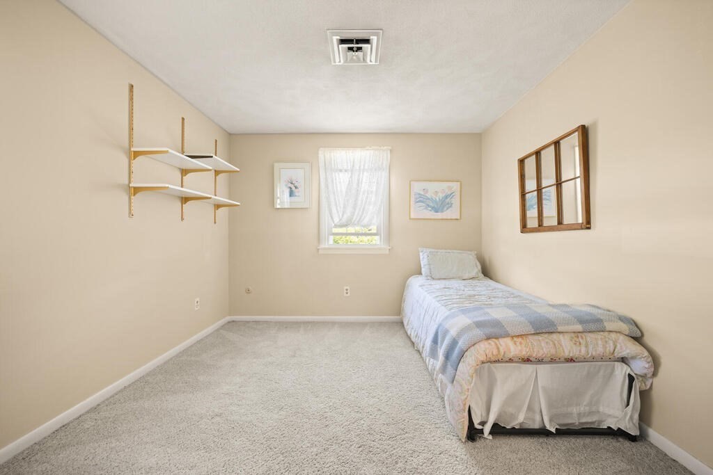 11 Rickey Drive Maynard, MA 01754 - Photo 13 of 29 a bedroom with a bed and a window