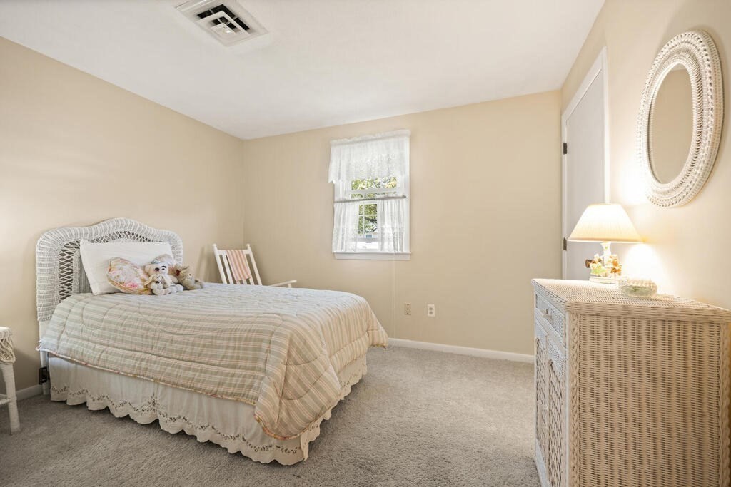 11 Rickey Drive Maynard, MA 01754 - Photo 15 of 29 a bedroom with a bed and a mirror