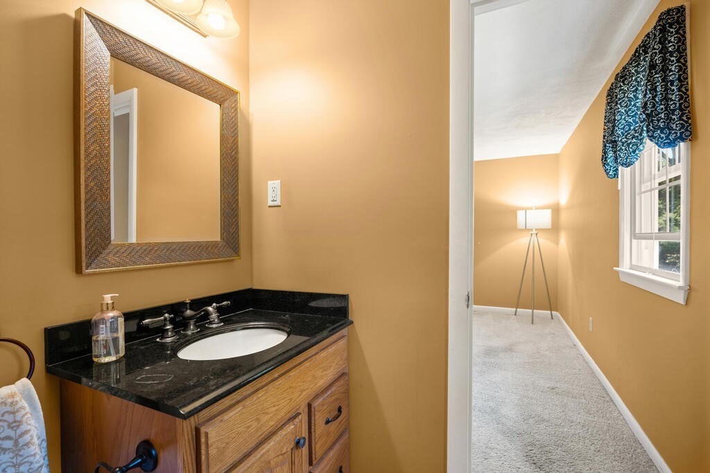 11 Rickey Drive Maynard, MA 01754 - Photo 17 of 29 a bathroom with a sink and a mirror