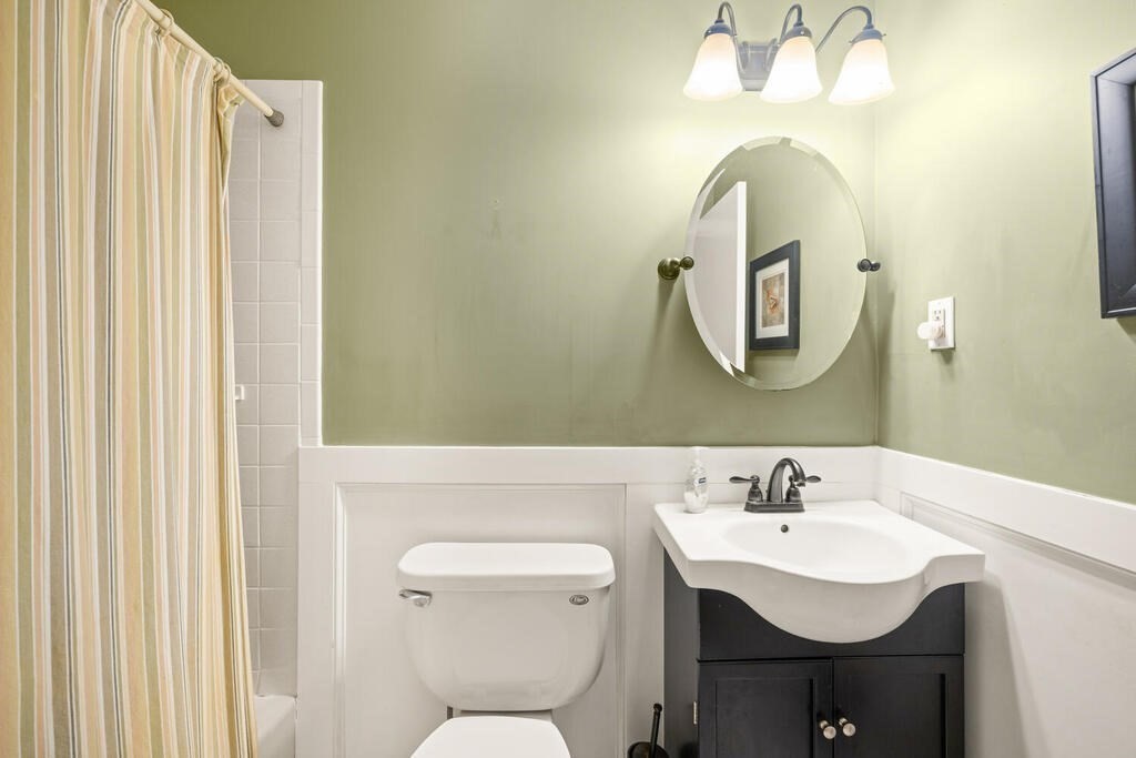 11 Rickey Drive Maynard, MA 01754 - Photo 18 of 29 a bathroom with a toilet sink and mirror