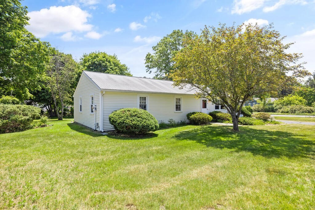 11 Rickey Drive Maynard, MA 01754 - Photo 22 of 29 a view of a house with backyard and garden