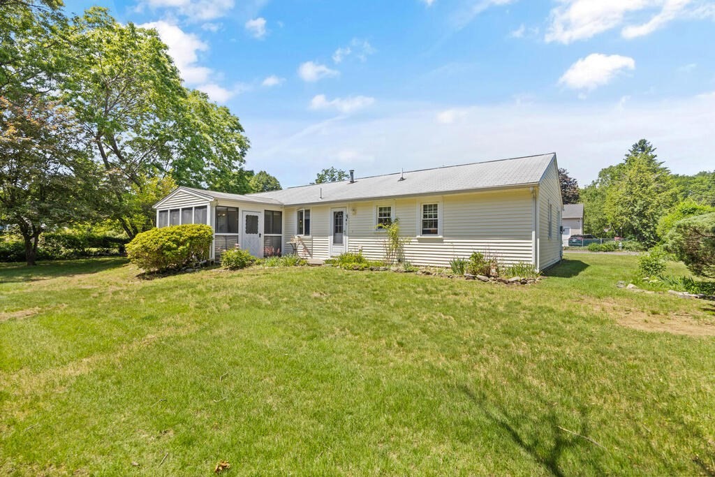 11 Rickey Drive Maynard, MA 01754 - Photo 27 of 29 a view of a house with a backyard