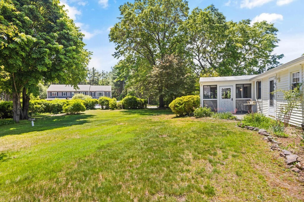 11 Rickey Drive Maynard, MA 01754 - Photo 28 of 29 a view of a house with a yard and sitting area