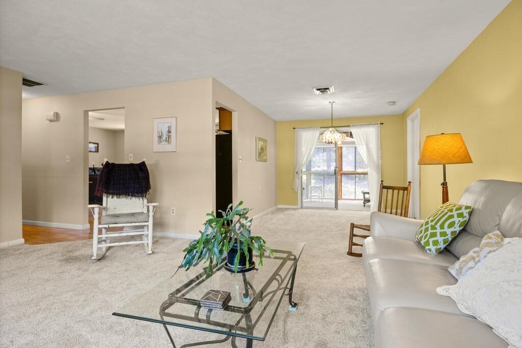 11 Rickey Drive Maynard, MA 01754 - Photo 4 of 29 a living room with furniture and a large window