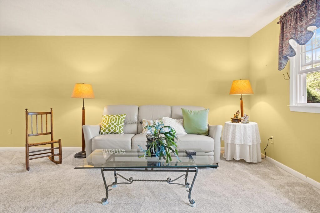11 Rickey Drive Maynard, MA 01754 - Photo 8 of 29 a living room with furniture and a lamp