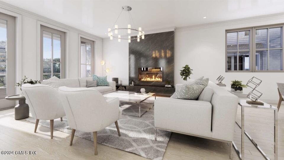 59 Locust Street, Unit A Greenwich, CT 06830 - Photo 10 of 24 a living room with furniture and a chandelier