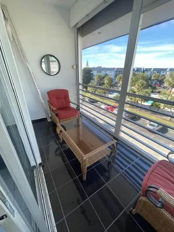 a room with furniture and a large window