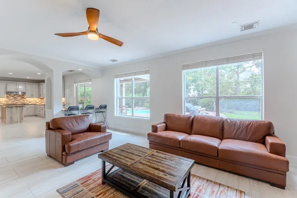 a living room with furniture and a large window