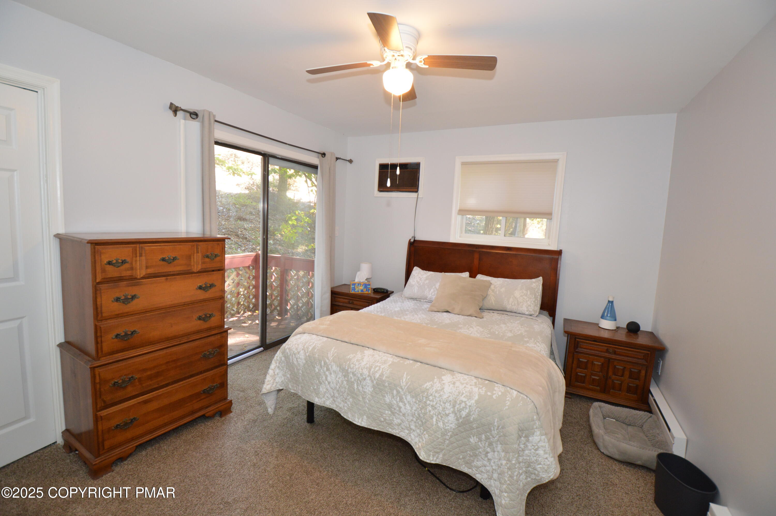 128 Ashley Court Bushkill, PA 18324 - Photo 26 of 43 a bedroom with a bed and a ceiling fan
