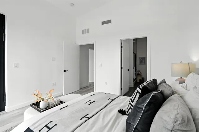 a bed room with a bed and a window