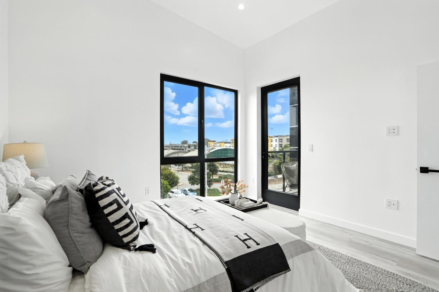 889 McLellan Drive, Unit 302 South San Francisco, CA 94080 - Photo 24 of 29 a bedroom with a bed and a large window