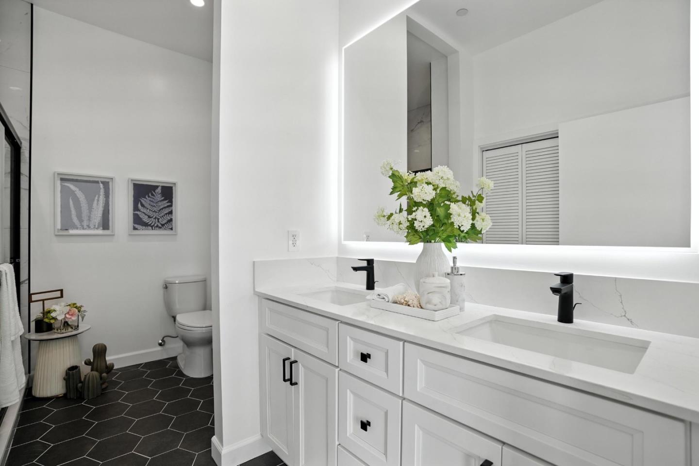 889 McLellan Drive, Unit 302 South San Francisco, CA 94080 - Photo 25 of 29 a bathroom with a sink a toilet and a mirror