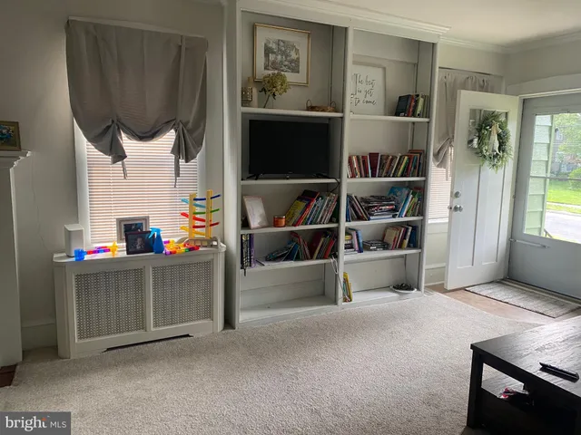 a living room with a couch and a flat screen tv