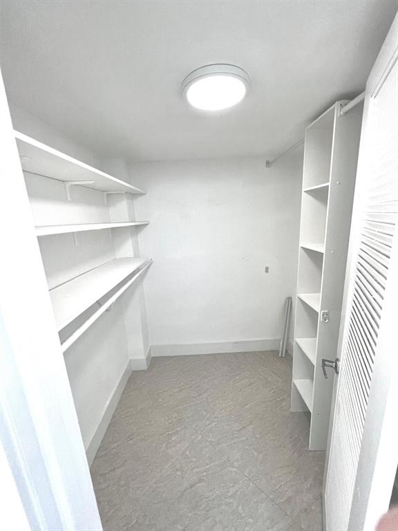 1345 Lincoln Road, Unit 1201 Miami Beach, FL 33139 - Photo 24 of 30 a view of an empty walk in closet