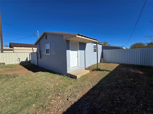 a house view with a backyard space