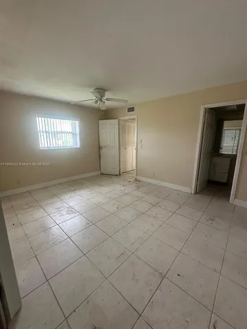 a kitchen with a sink a stove and cabinets