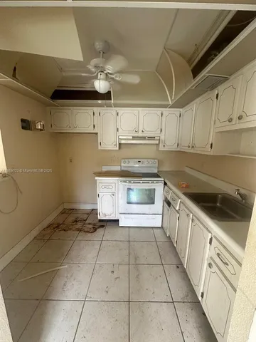 a view of a livingroom with furniture and a window