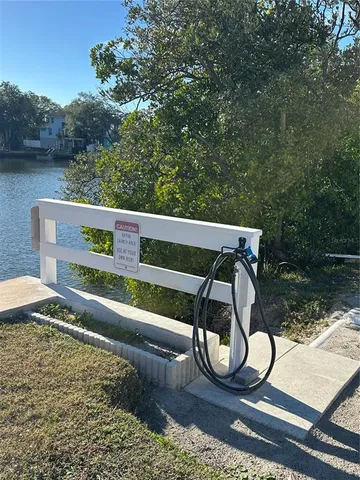 a view of a lake with large trees
