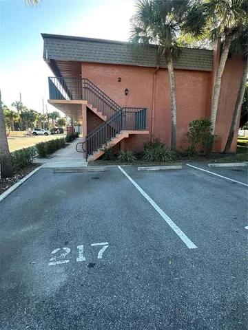 a view of a house with a yard and garage