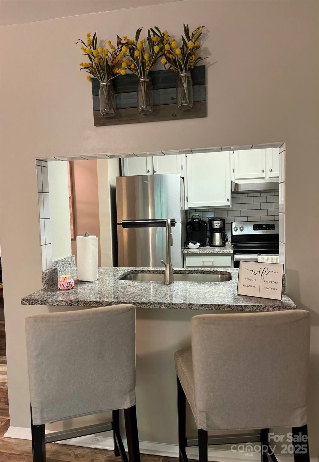229 Windsor Point Road, Unit 6B Columbia, SC 29223 - Photo 1 of 15 a view of kitchen with stainless steel appliances granite countertop a sink and cabinets