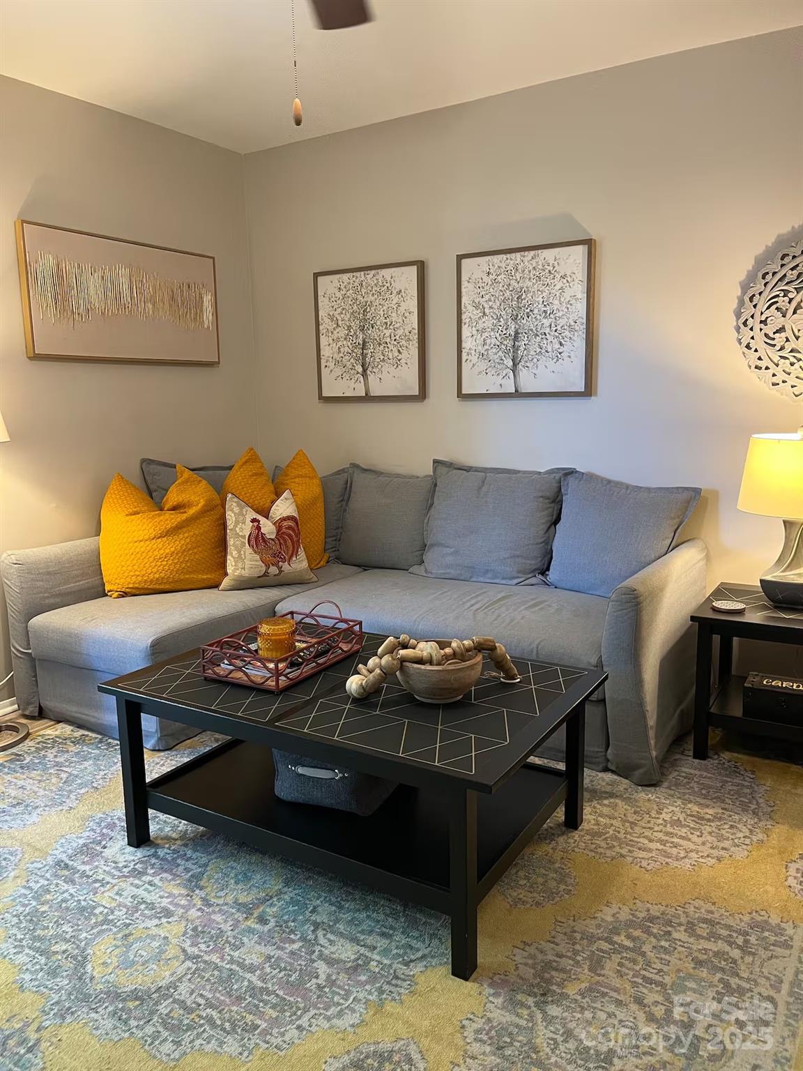 229 Windsor Point Road, Unit 6B Columbia, SC 29223 - Photo 15 of 15 a living room with furniture a couch and paintings on the wall