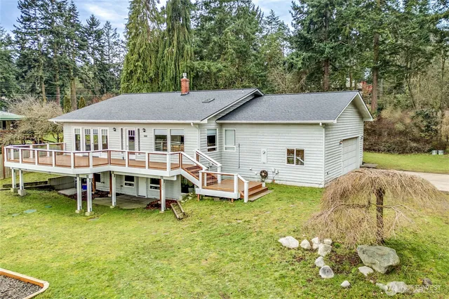 a view of a house with a yard porch and sitting area