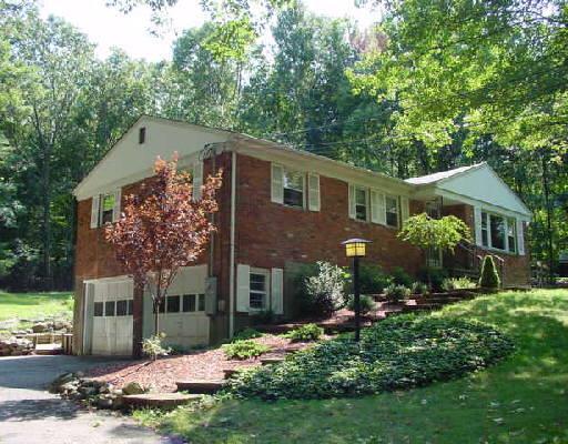 432 Branchville Road Ridgefield, CT 06877 - Photo 1 of 1 a front view of a house with a yard