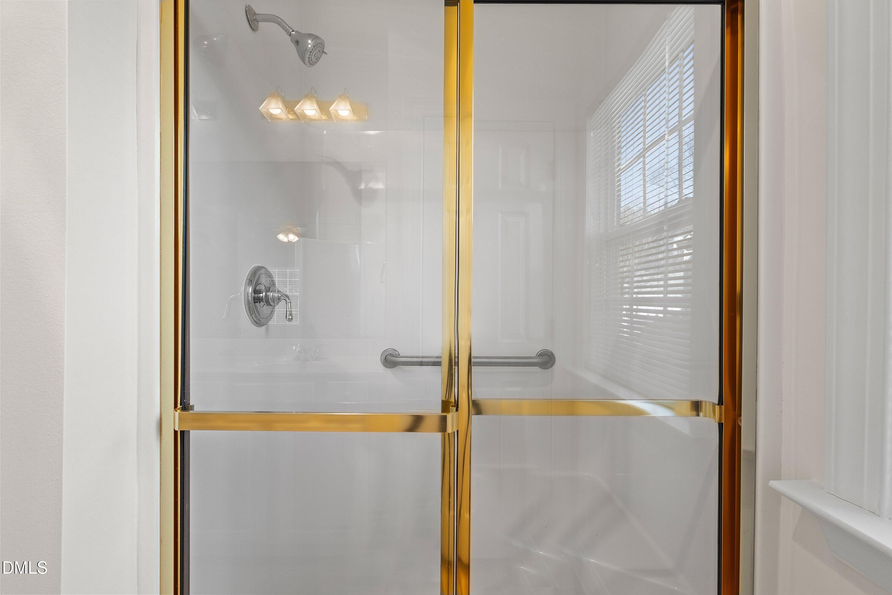 105 Rockport Ridge Way Cary, NC 27519 - Photo 35 of 43 a bathroom with a tub and shower