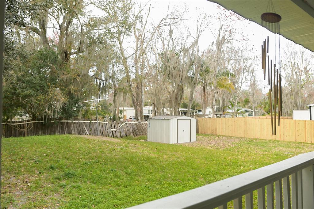 630 Carpenter Road Orlando, FL 32833 - Photo 18 of 23 a swimming pool with outdoor seating and garden